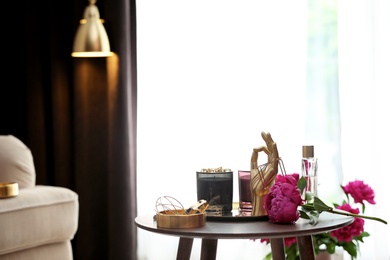 Photo of Composition with stylish accessories and interior elements on table indoors