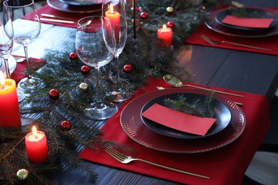 Elegant Christmas table setting with blank place cards and festive decor