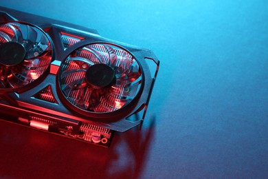 Photo of Computer graphics card on color background, above view. Space for text