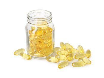 Photo of Bottle and pile of softgel capsules isolated on white