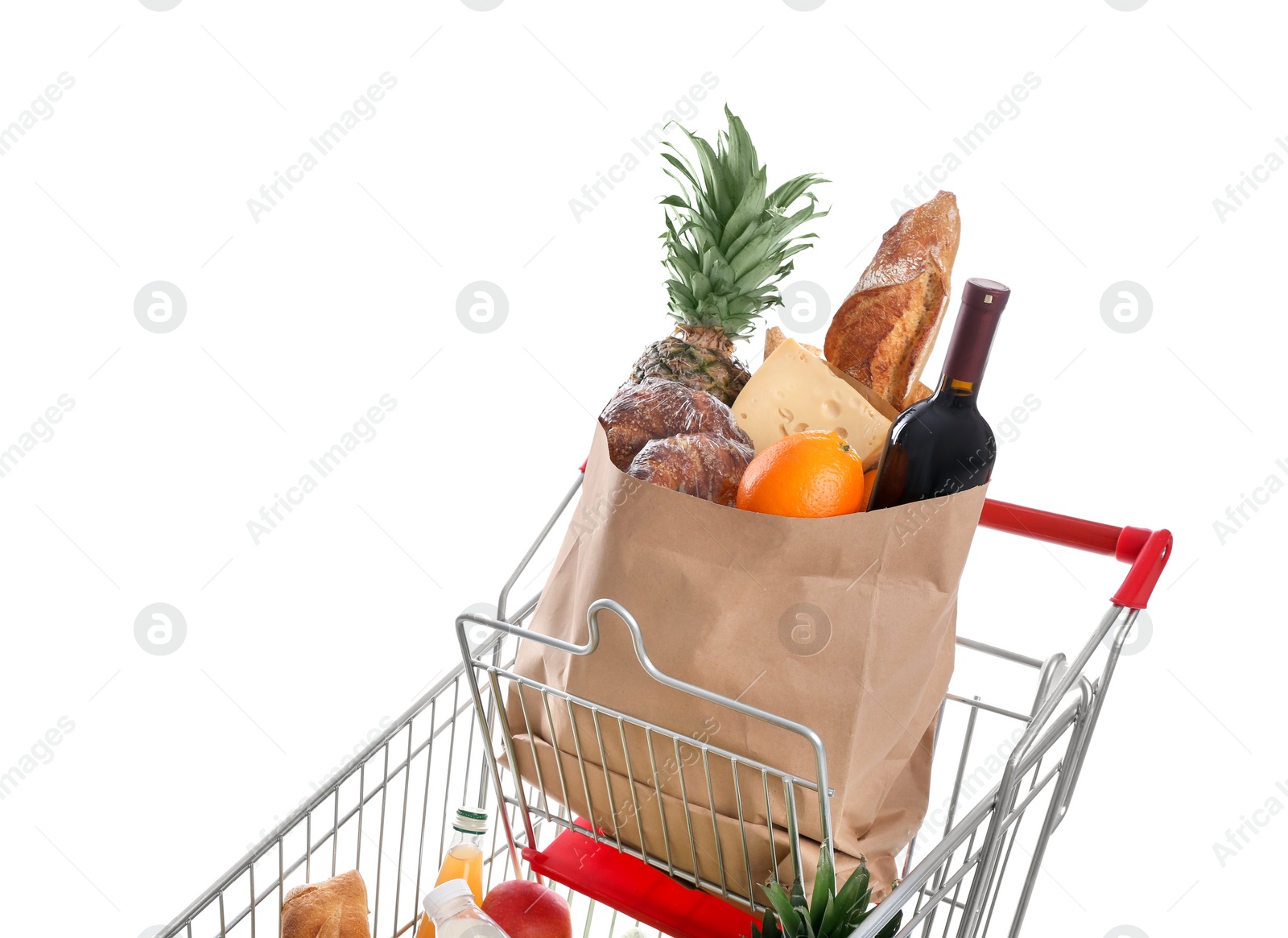 Photo of Shopping cart with groceries on white background