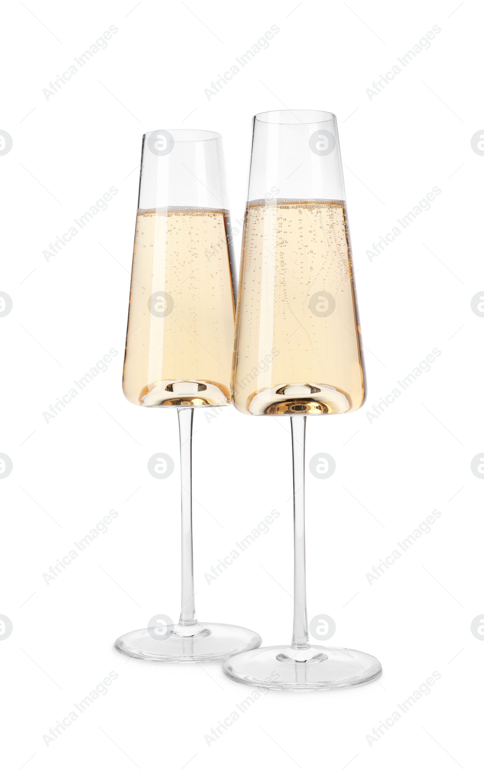 Photo of Glasses of champagne on white background. Festive drink