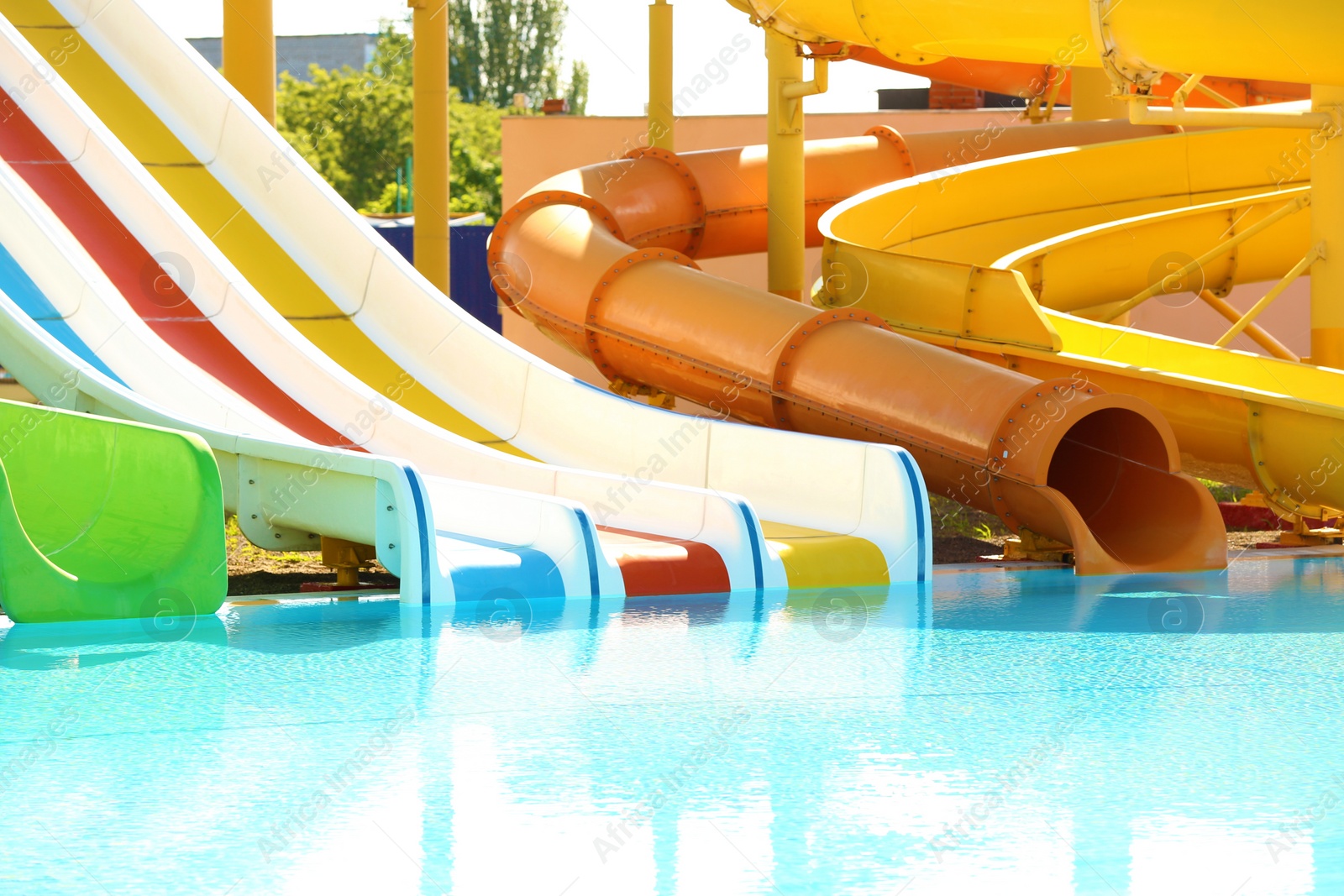 Photo of Different colorful slides in water park on sunny day