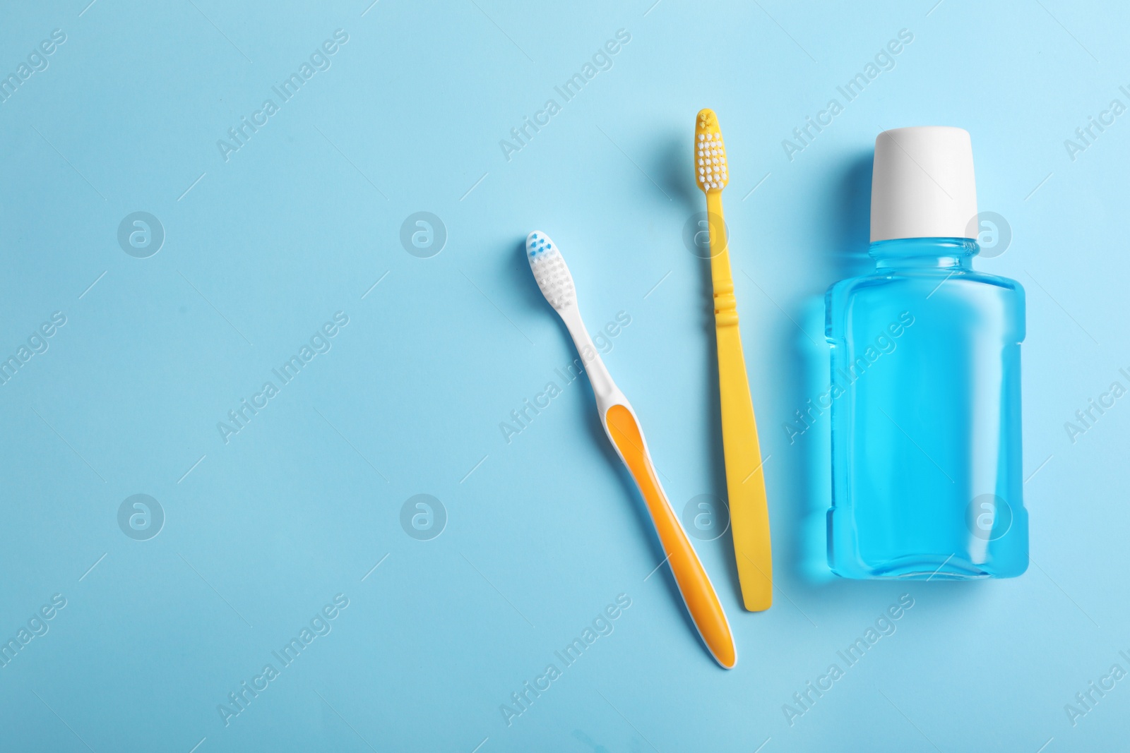 Photo of Flat lay composition with oral care products and space for text on color background. Teeth hygiene