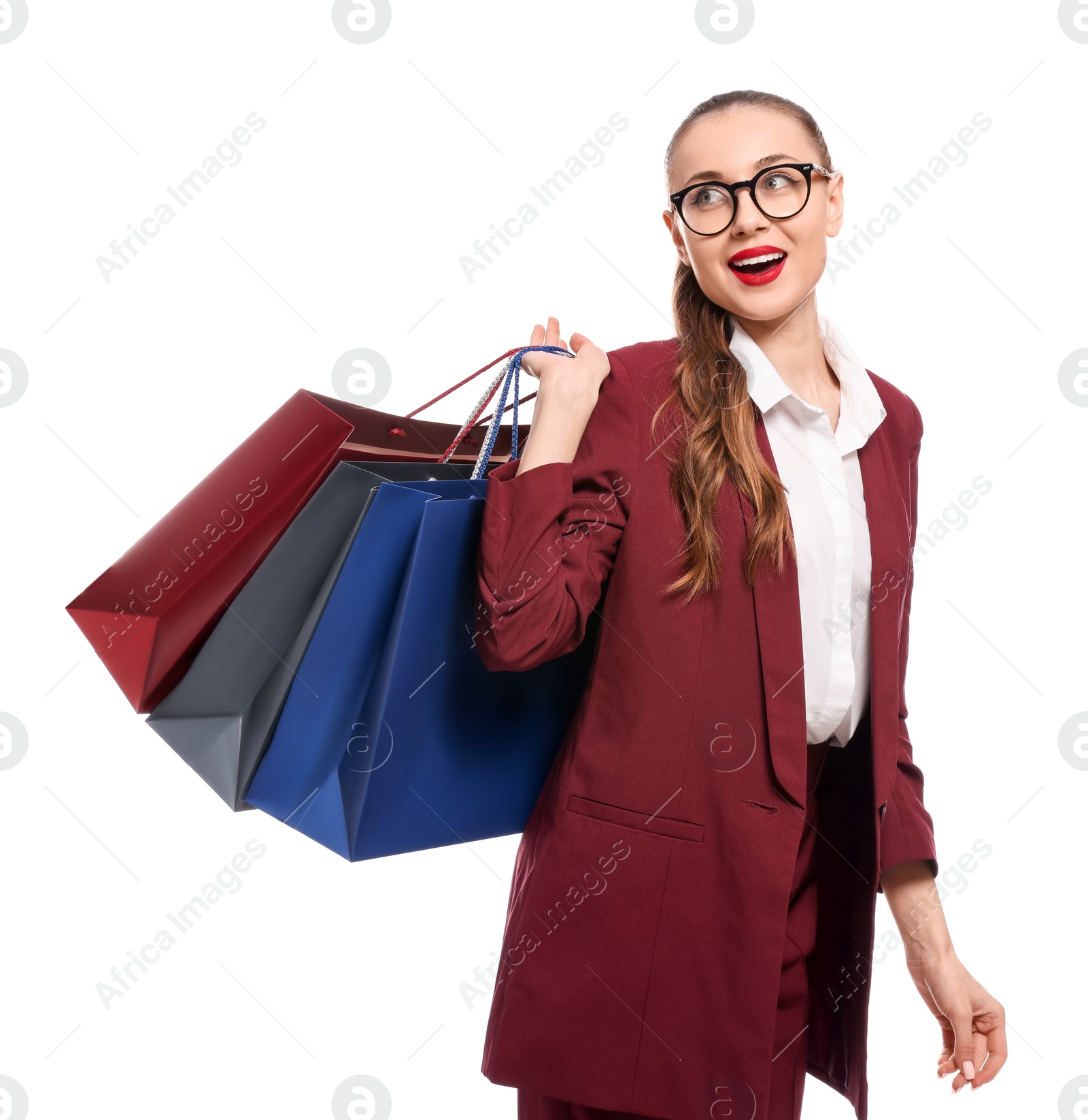 Photo of Stylish young businesswoman with shopping bags on white background