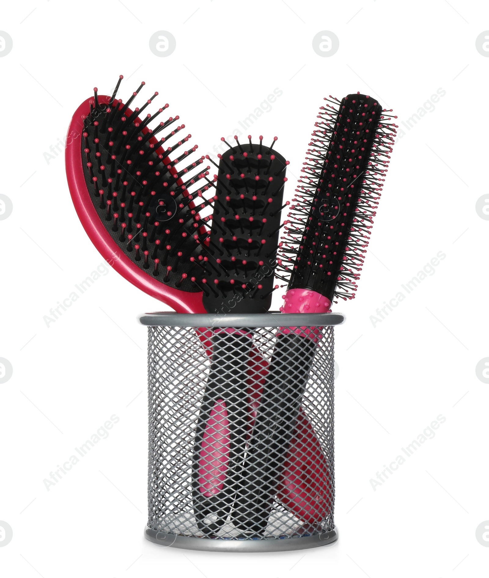 Photo of Set of hairbrushes in holder on white background