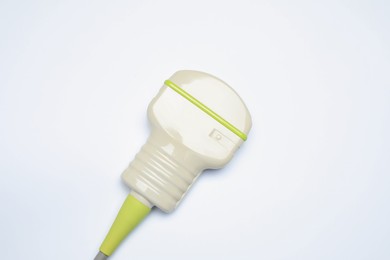 Photo of Ultrasonic transducer on light background, top view