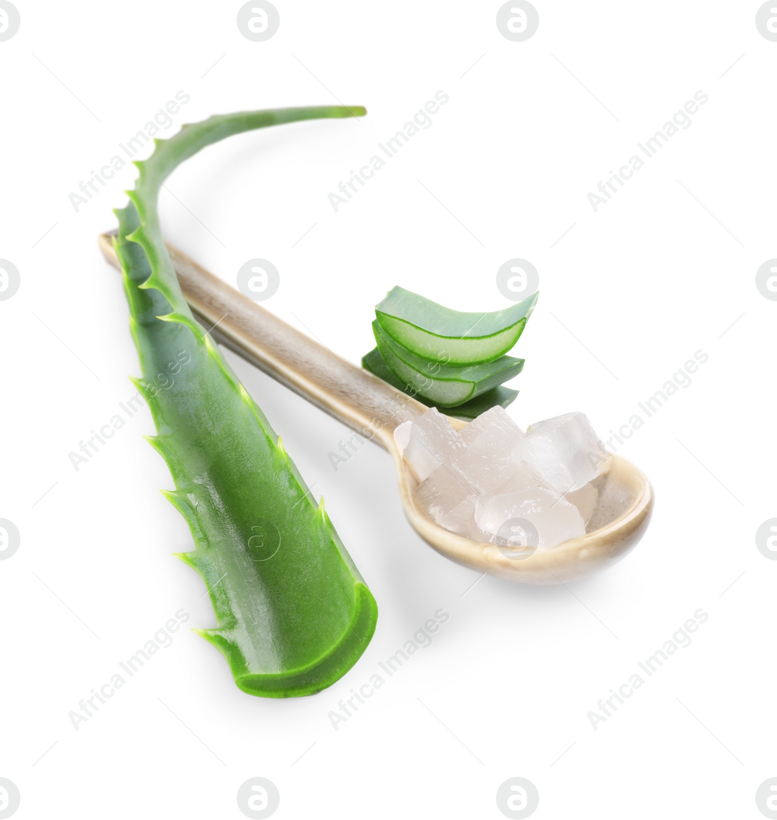 Photo of Spoon with peeled aloe vera and pieces of plant isolated on white