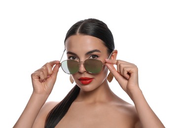 Photo of Attractive woman wearing fashionable sunglasses on white background