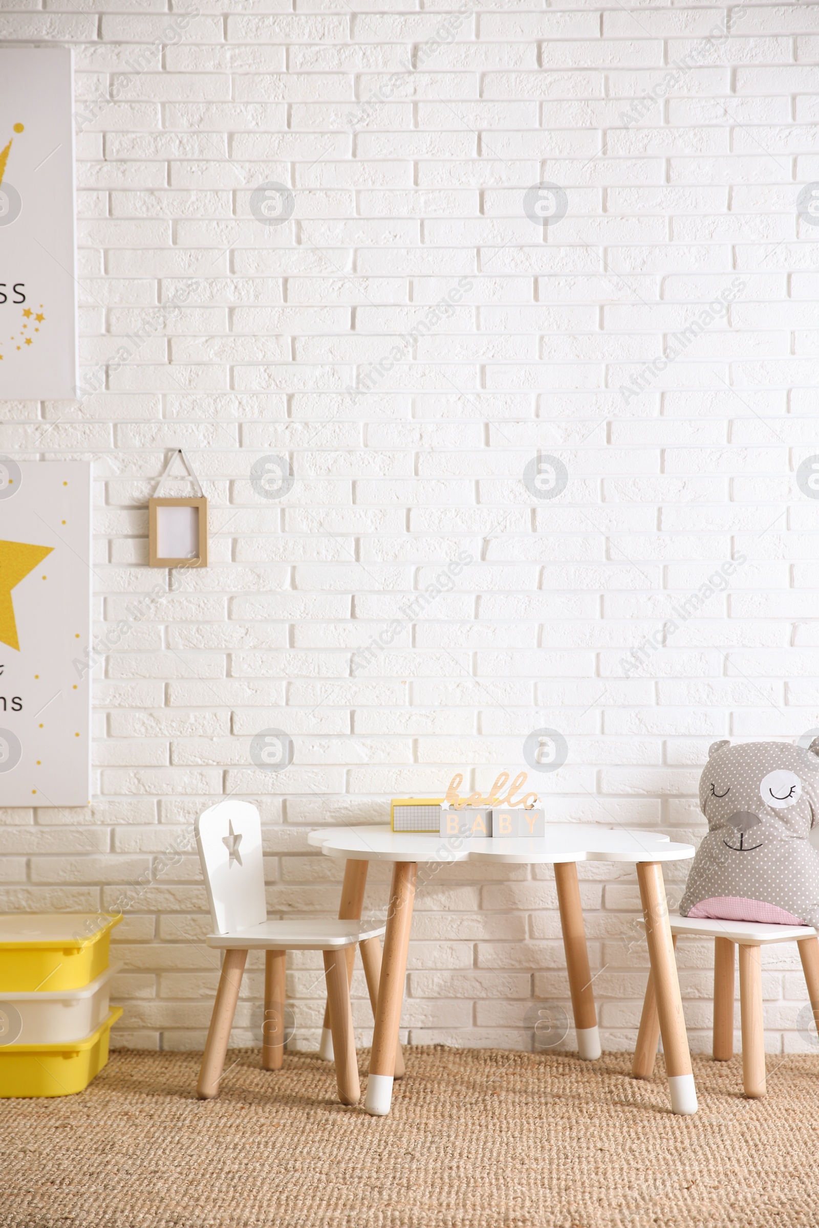 Photo of Baby room interior with toys and stylish furniture, space for text