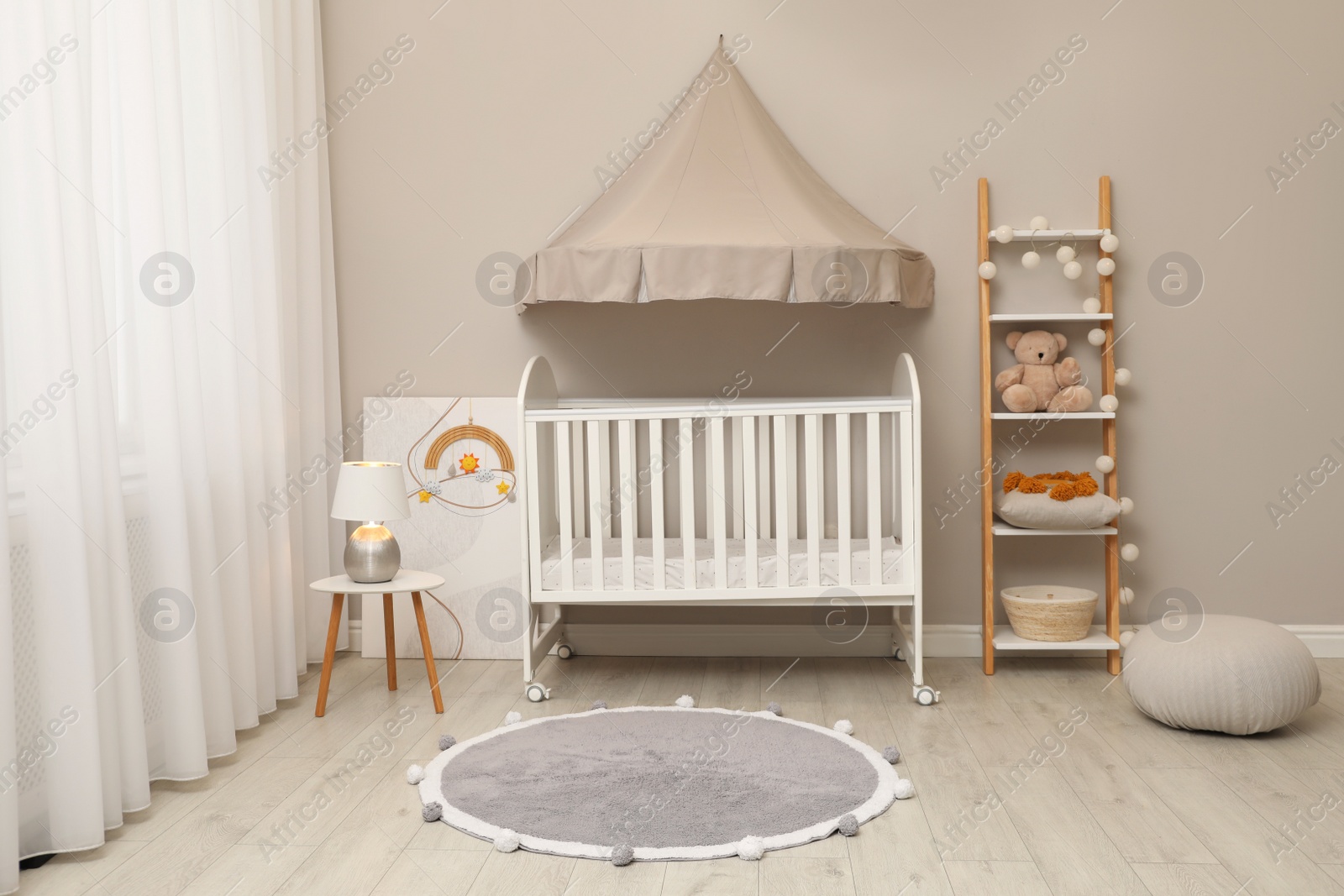 Photo of Modern baby room interior with stylish crib