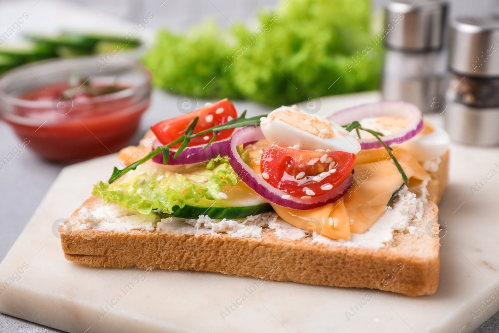 Photo of Delicious sandwich served on light table, closeup