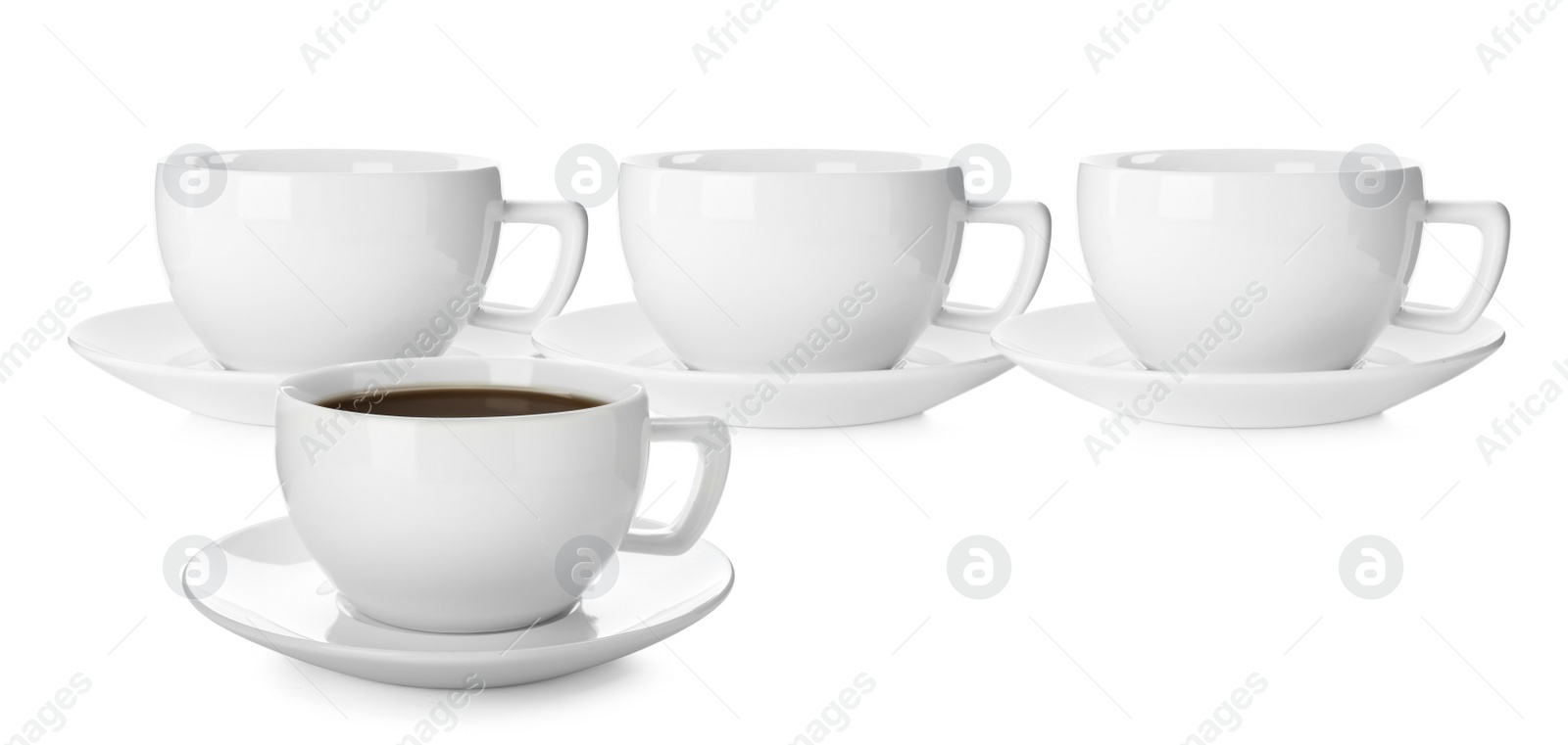 Image of Empty ceramic cups and one with aromatic coffee on white background. Banner design