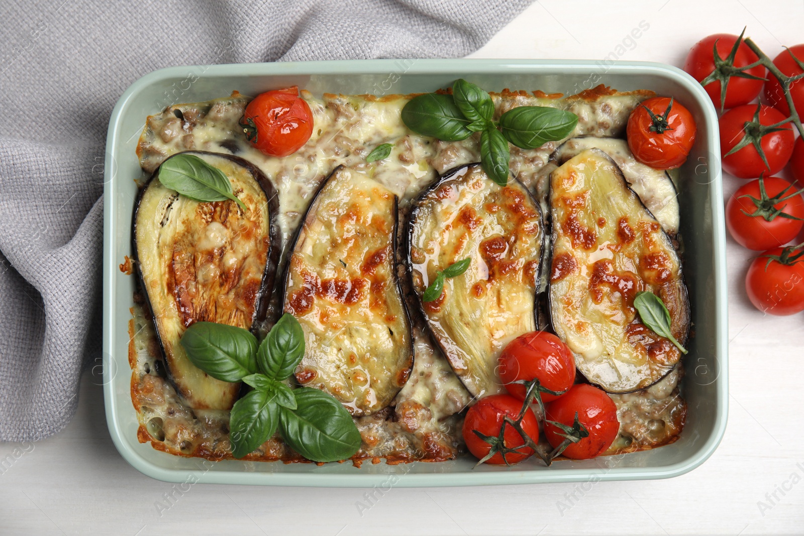 Photo of Delicious eggplant lasagna in baking dish on white wooden table, top view