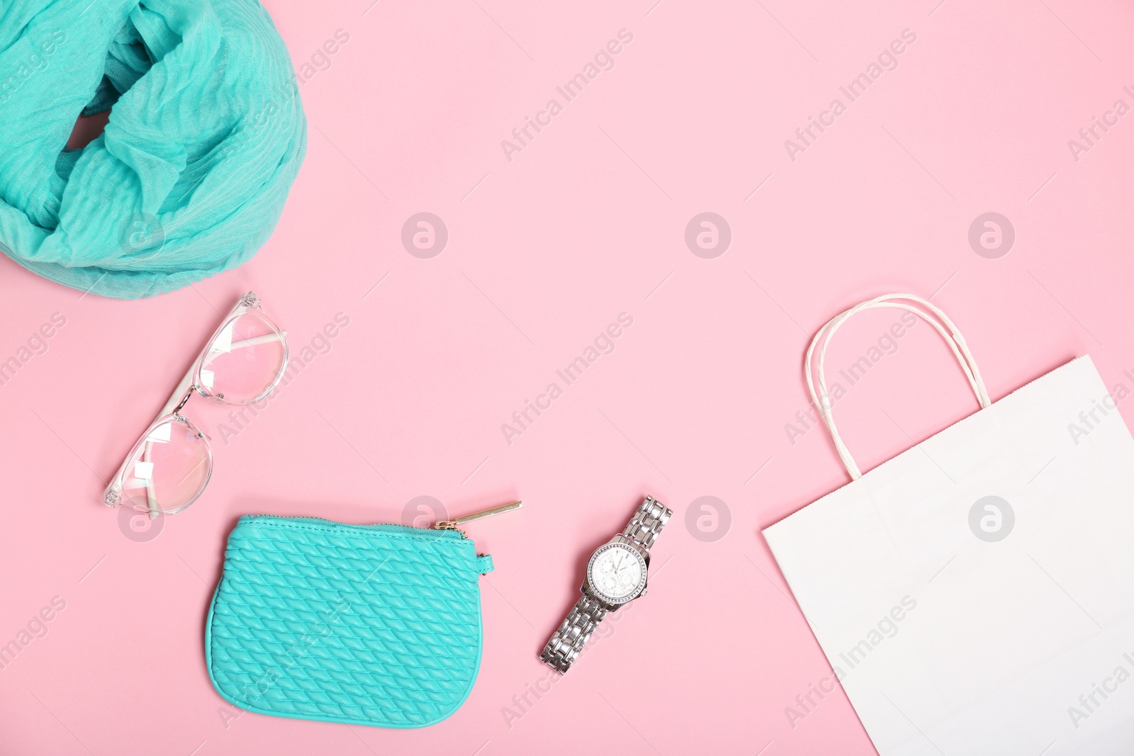 Photo of Stylish flat lay composition with shopping bag on color background