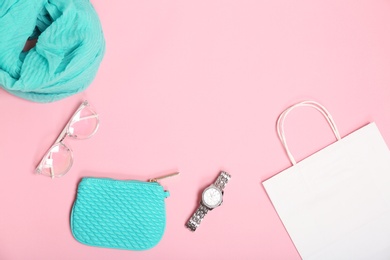 Stylish flat lay composition with shopping bag on color background