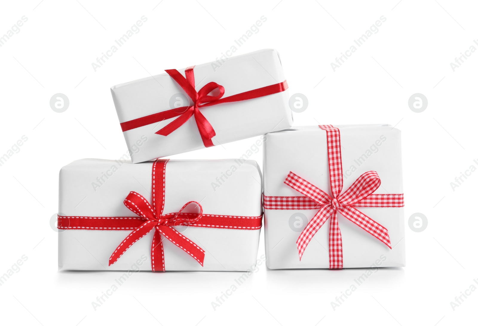 Photo of Beautifully wrapped gift boxes on white background