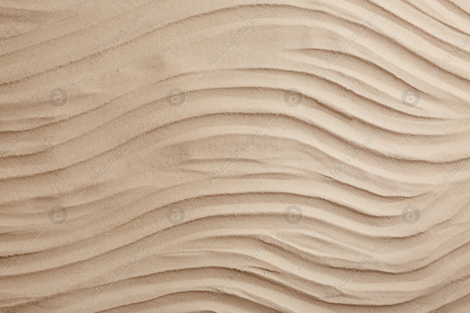 Photo of Dry beach sand as background, top view