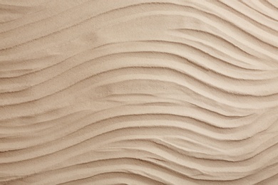 Photo of Dry beach sand as background, top view