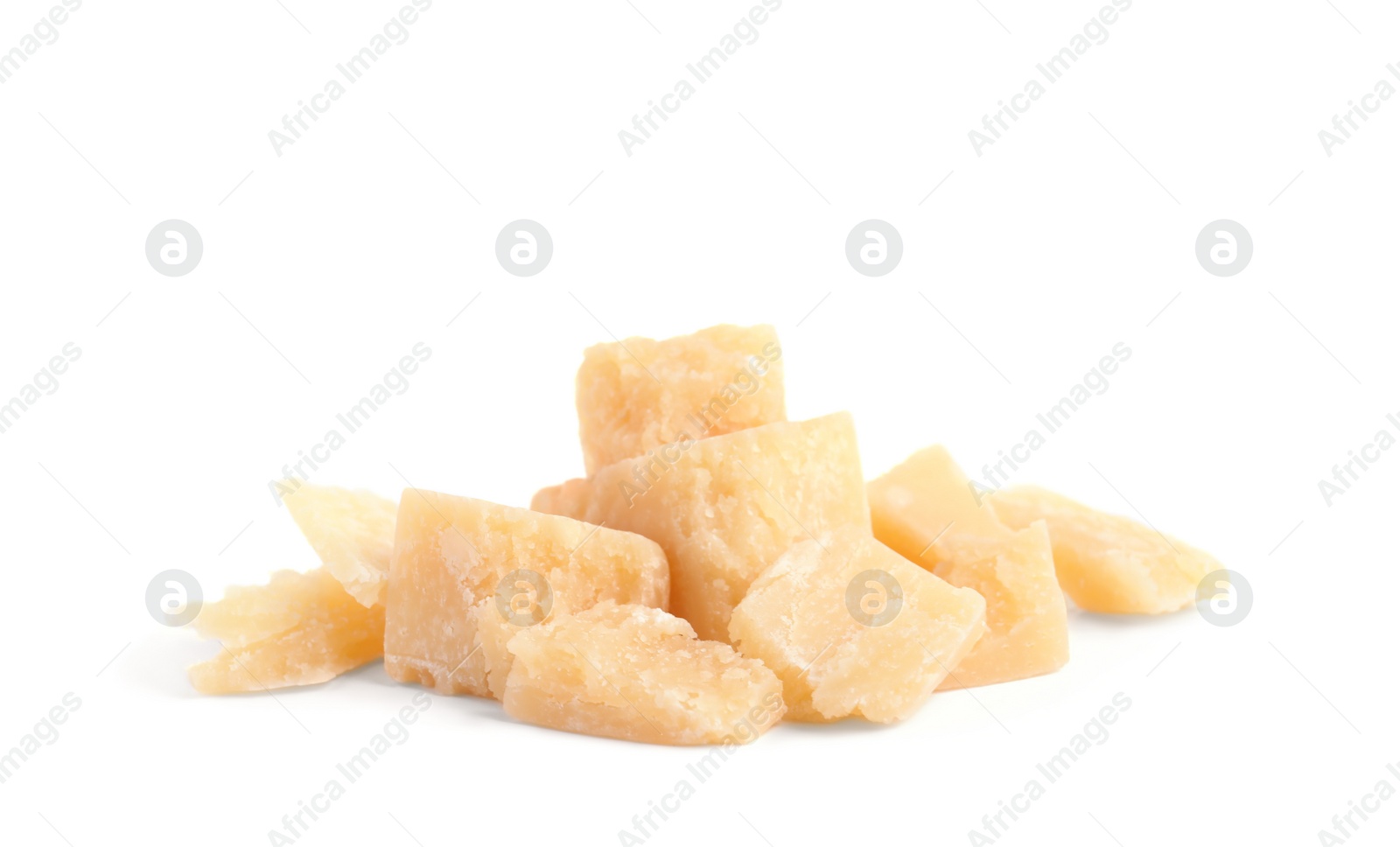 Photo of Pieces of delicious parmesan cheese on white background