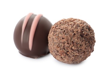 Different delicious chocolate truffles on white background