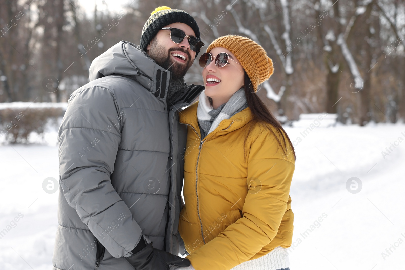 Photo of Beautiful happy couple spending time together on winter day