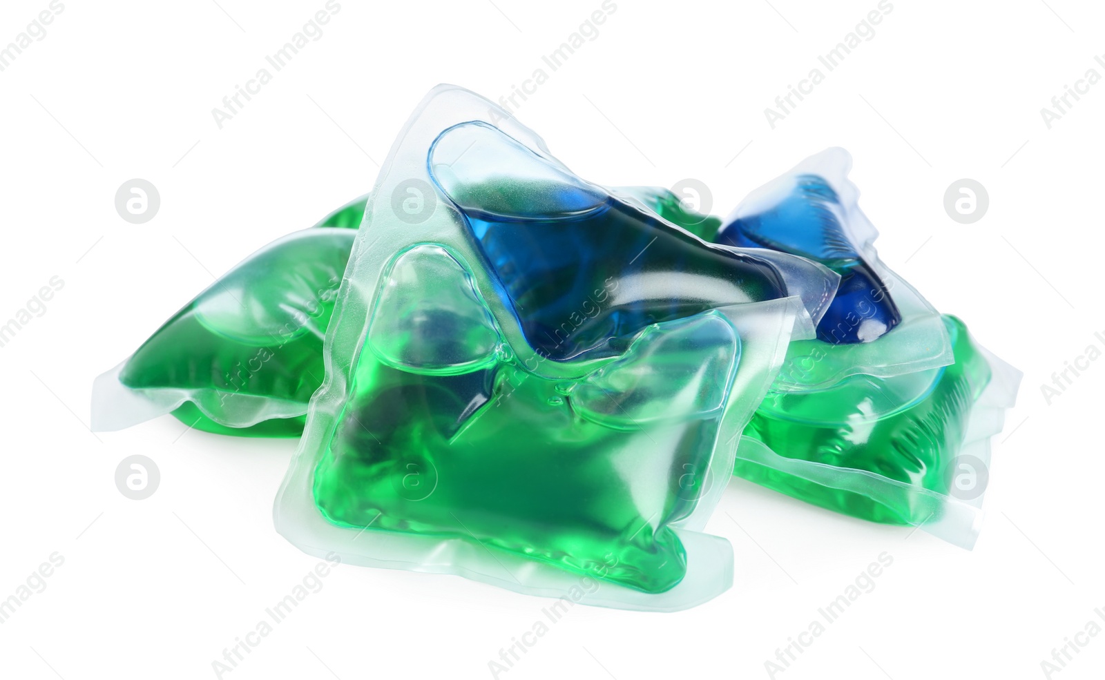 Photo of Heap of laundry capsules on white background