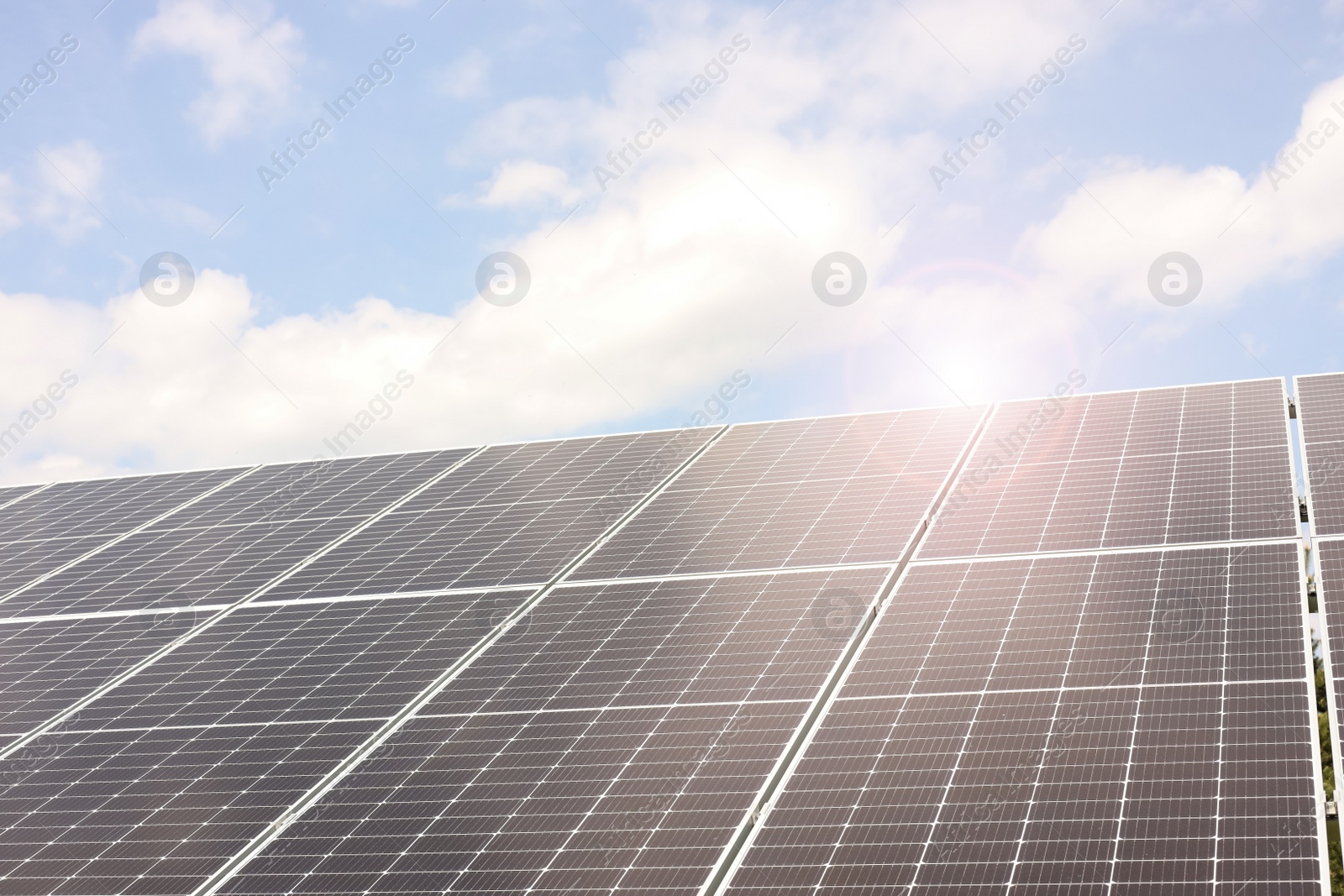 Photo of Solar panels outdoors on sunny day. Alternative energy