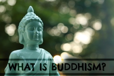 Decorative Buddha statue and text What Is Buddhism on blurred background