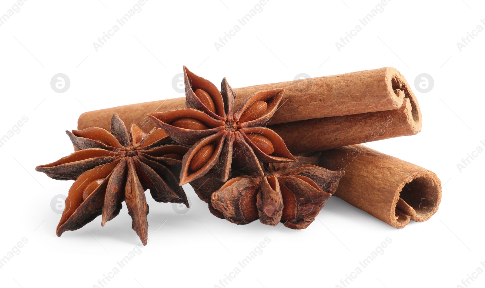 Photo of Aromatic cinnamon sticks and anise stars isolated on white