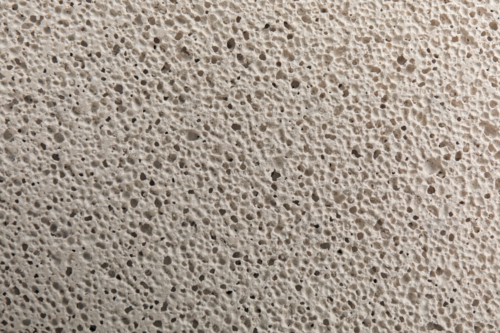 Photo of Texture of white pumice stone as background, closeup
