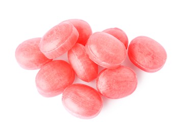 Many pink cough drops on white background
