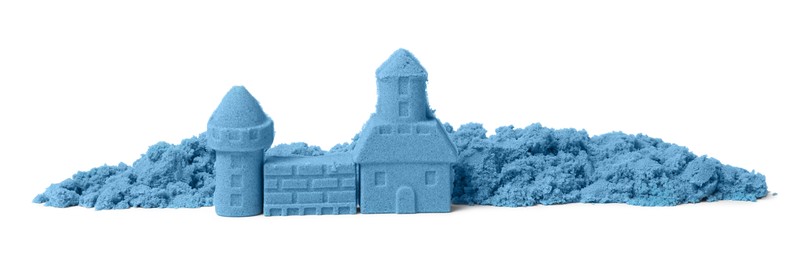 Photo of Castle made of blue kinetic sand isolated on white