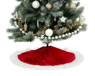 Photo of Decorated Christmas tree with red skirt on white background