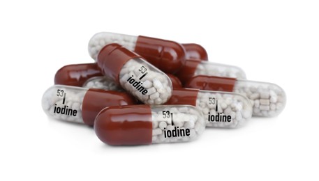 Photo of Pile of iodine pills isolated on white