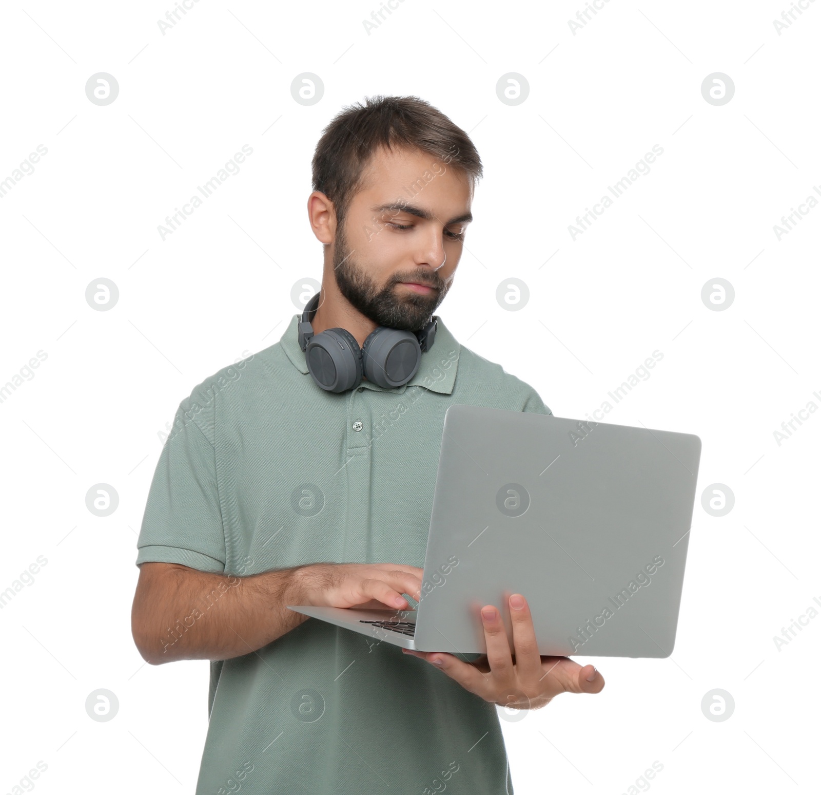 Photo of Student with headphones using laptop on white background