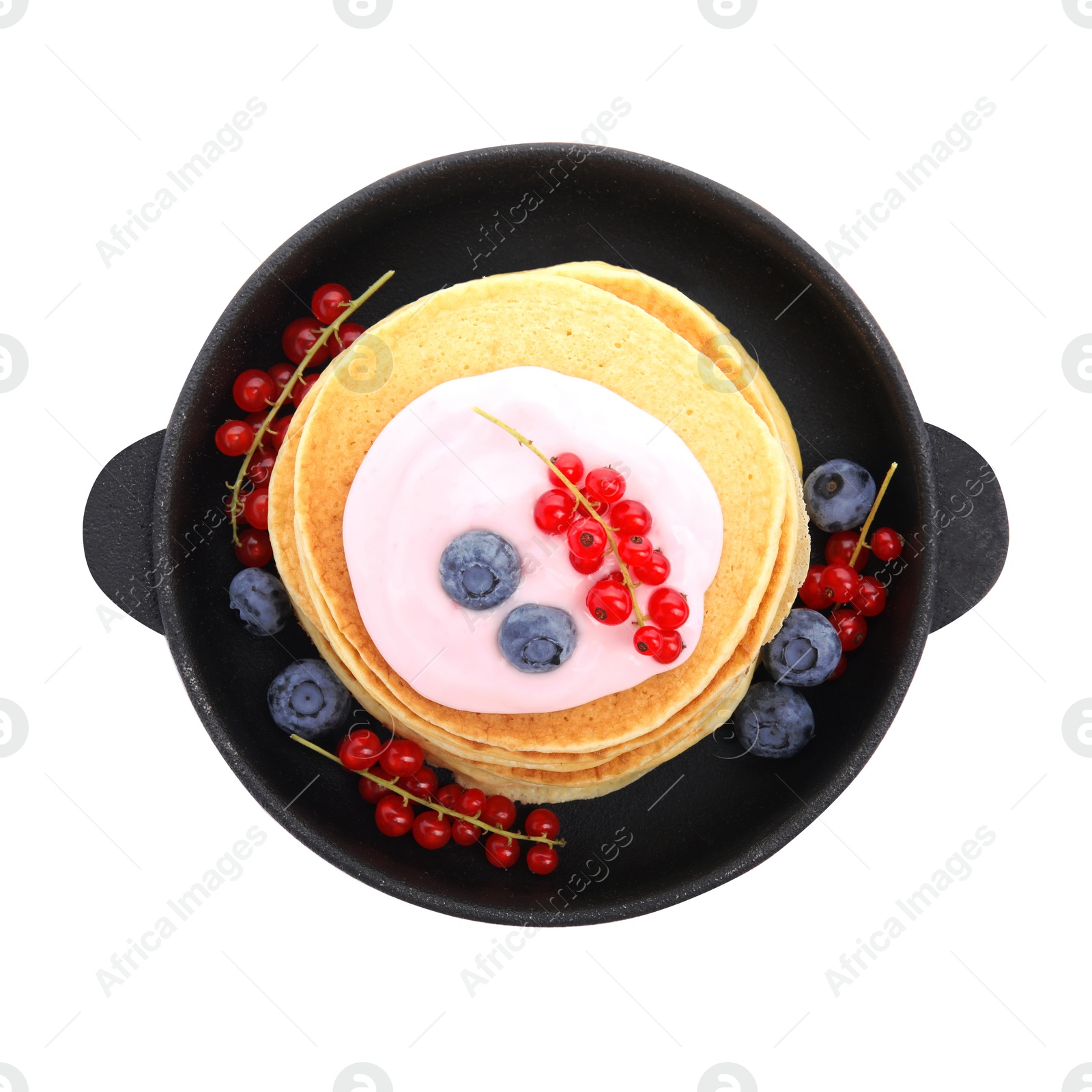 Photo of Tasty pancakes with natural yogurt, blueberries and red currants on white background, top view