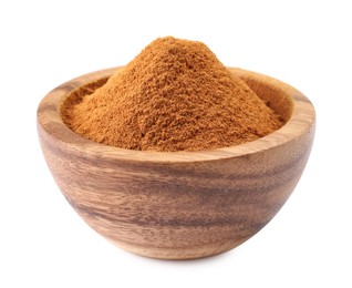 Photo of Dry aromatic cinnamon powder in wooden bowl isolated on white