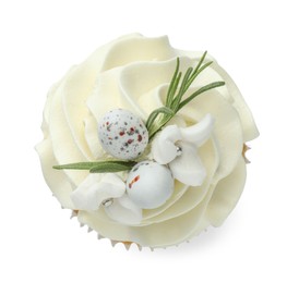 Photo of Tasty Easter cupcake with vanilla cream isolated on white, top view