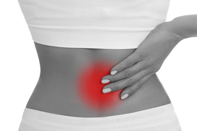 Woman suffering from back pain on white background, closeup