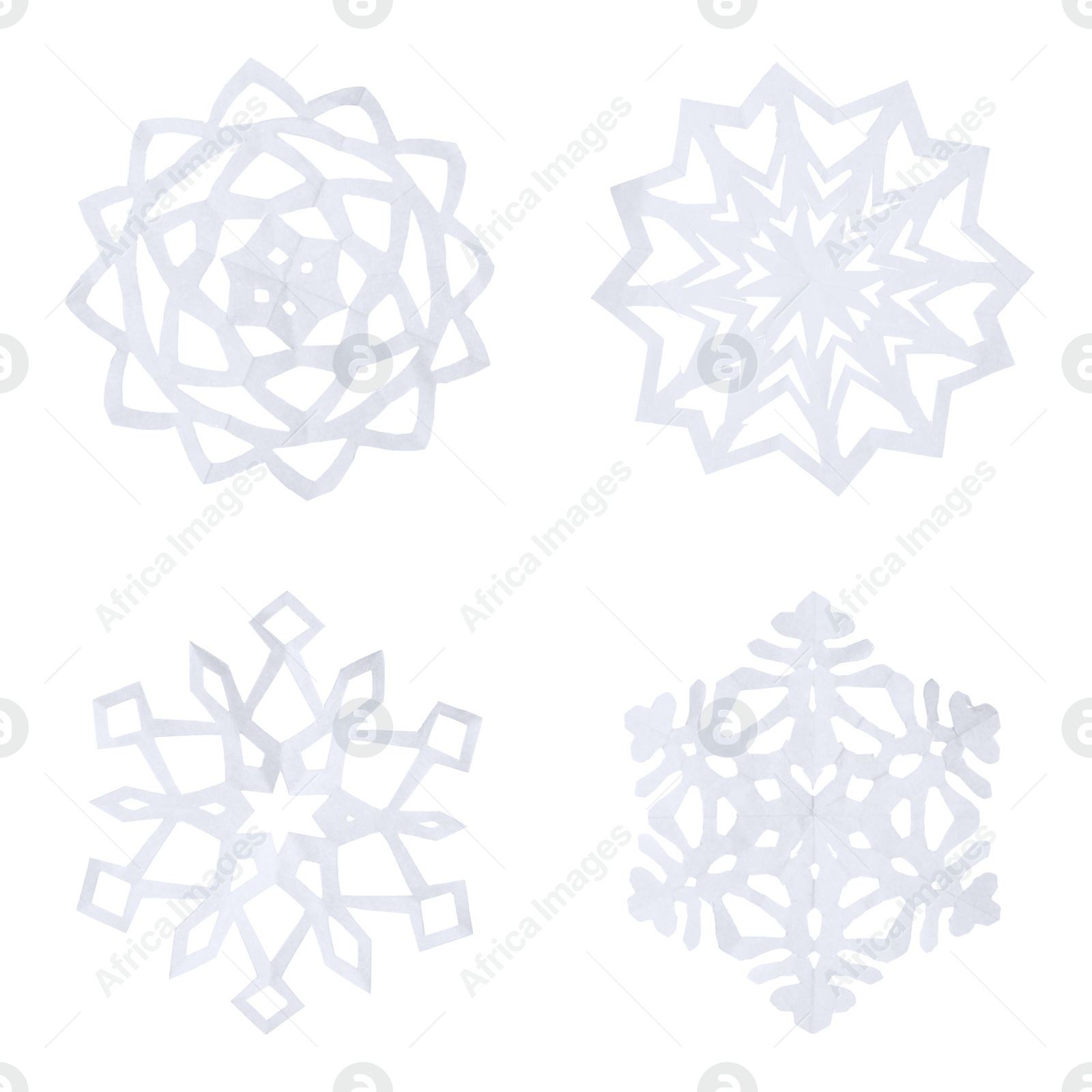 Image of Set of beautiful paper snowflakes on white background