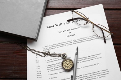 Photo of Last Will and Testament, glasses, pen, pocket watch and book on wooden table, flat lay