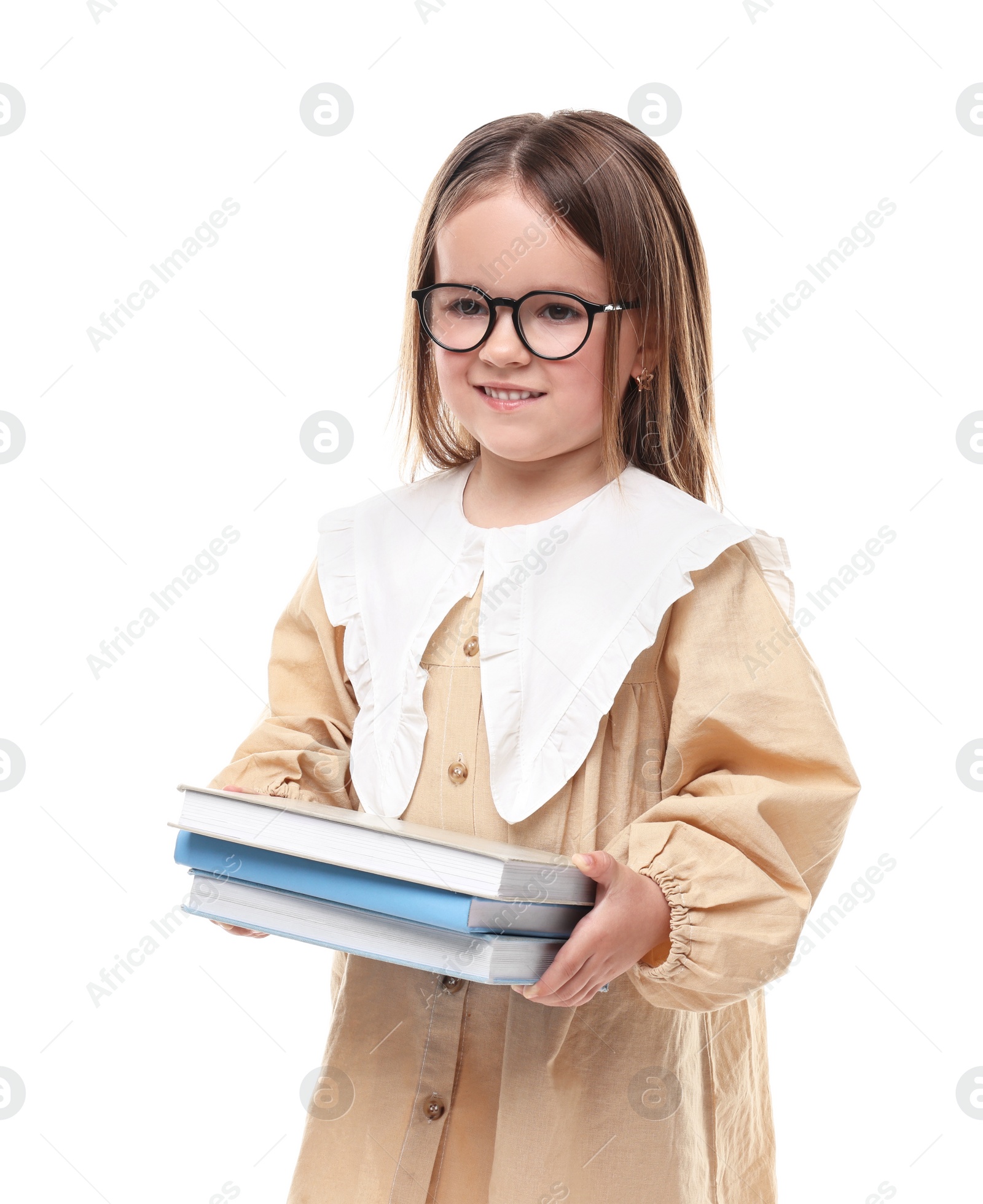 Photo of Cute little girl in glasses with books on white background