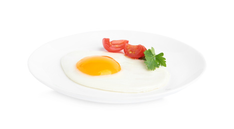 Photo of Tasty fried egg with parsley and tomato isolated on white