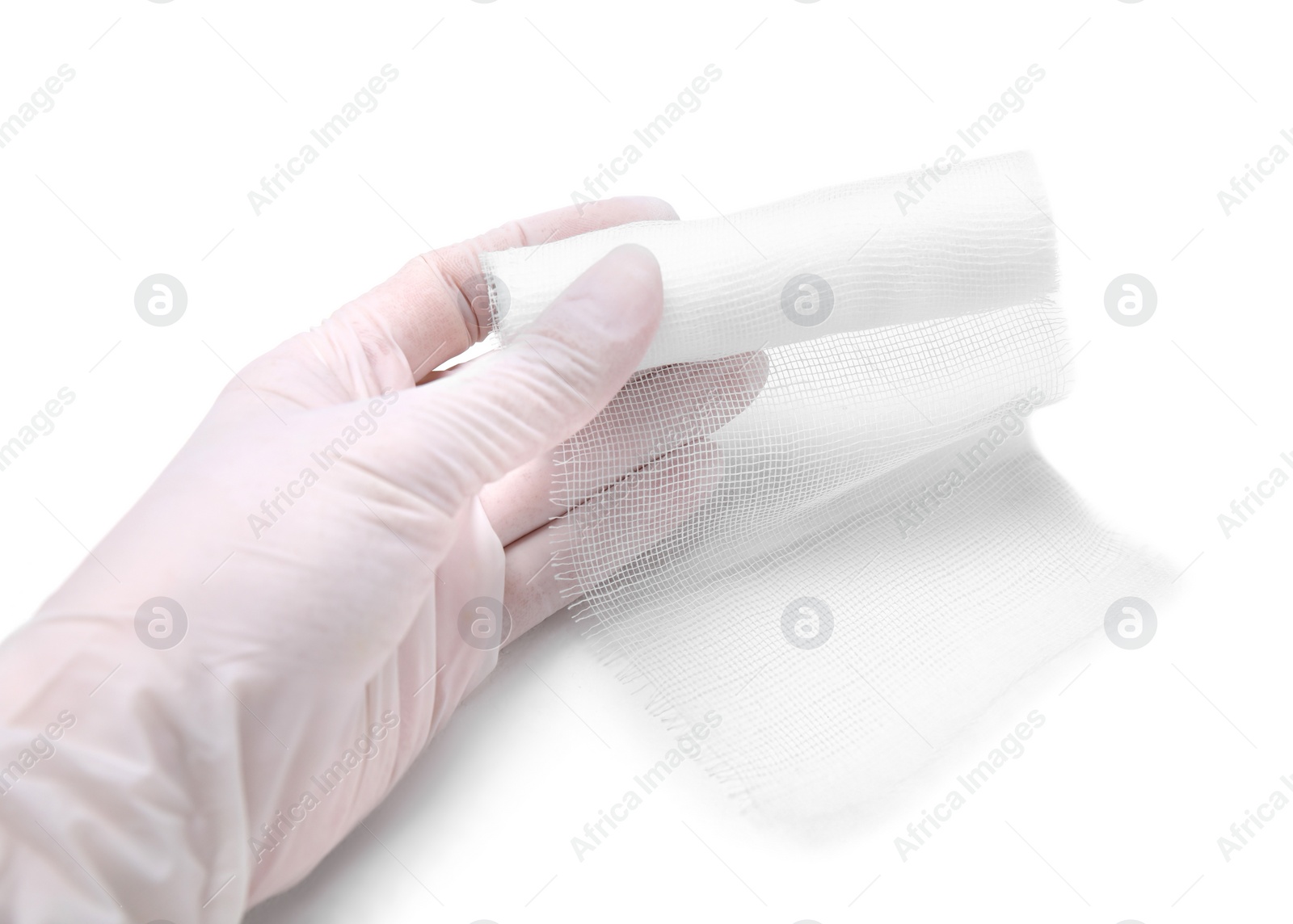 Photo of Doctor holding medical bandage on white background, closeup