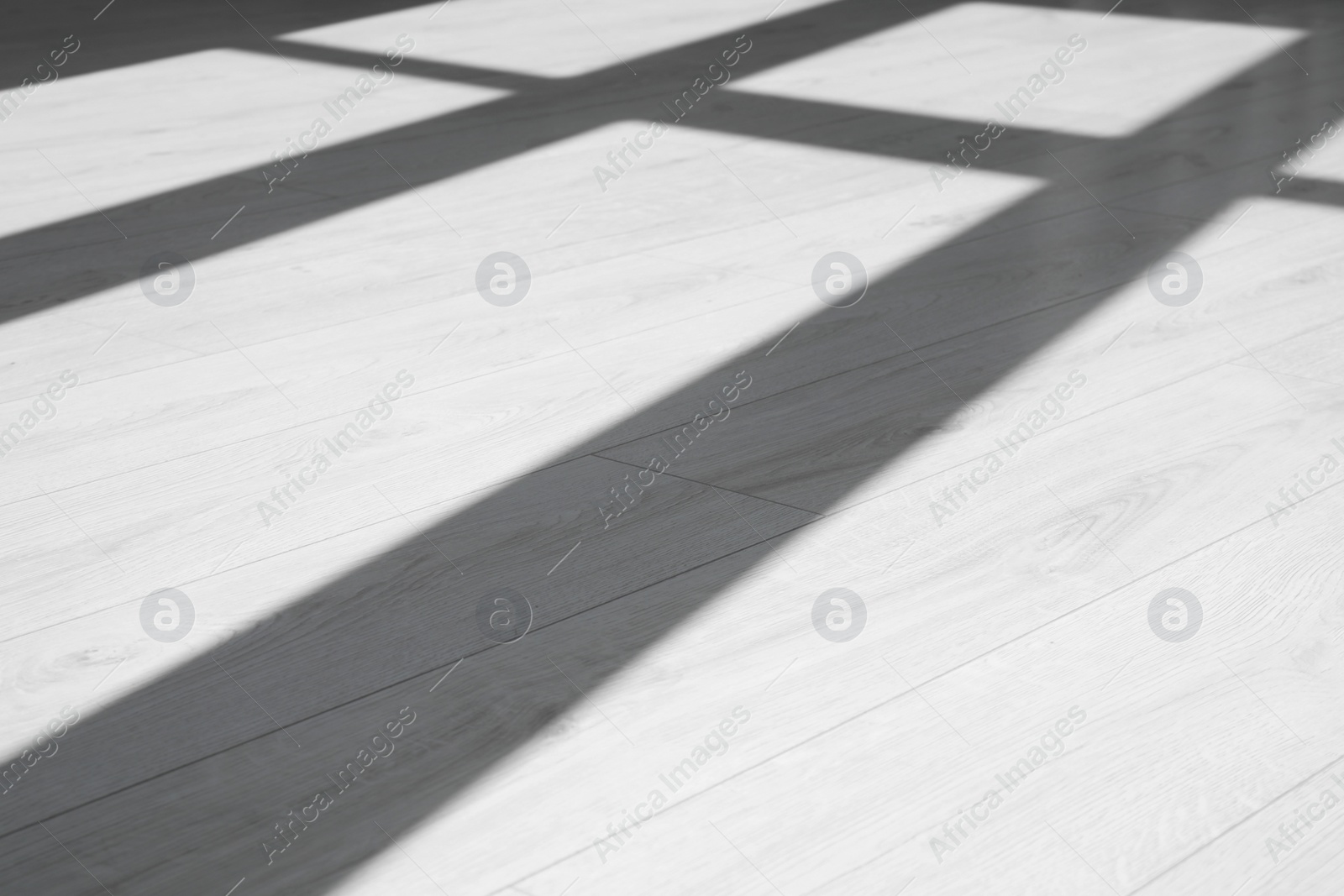 Photo of Shadow from window on white laminated floor