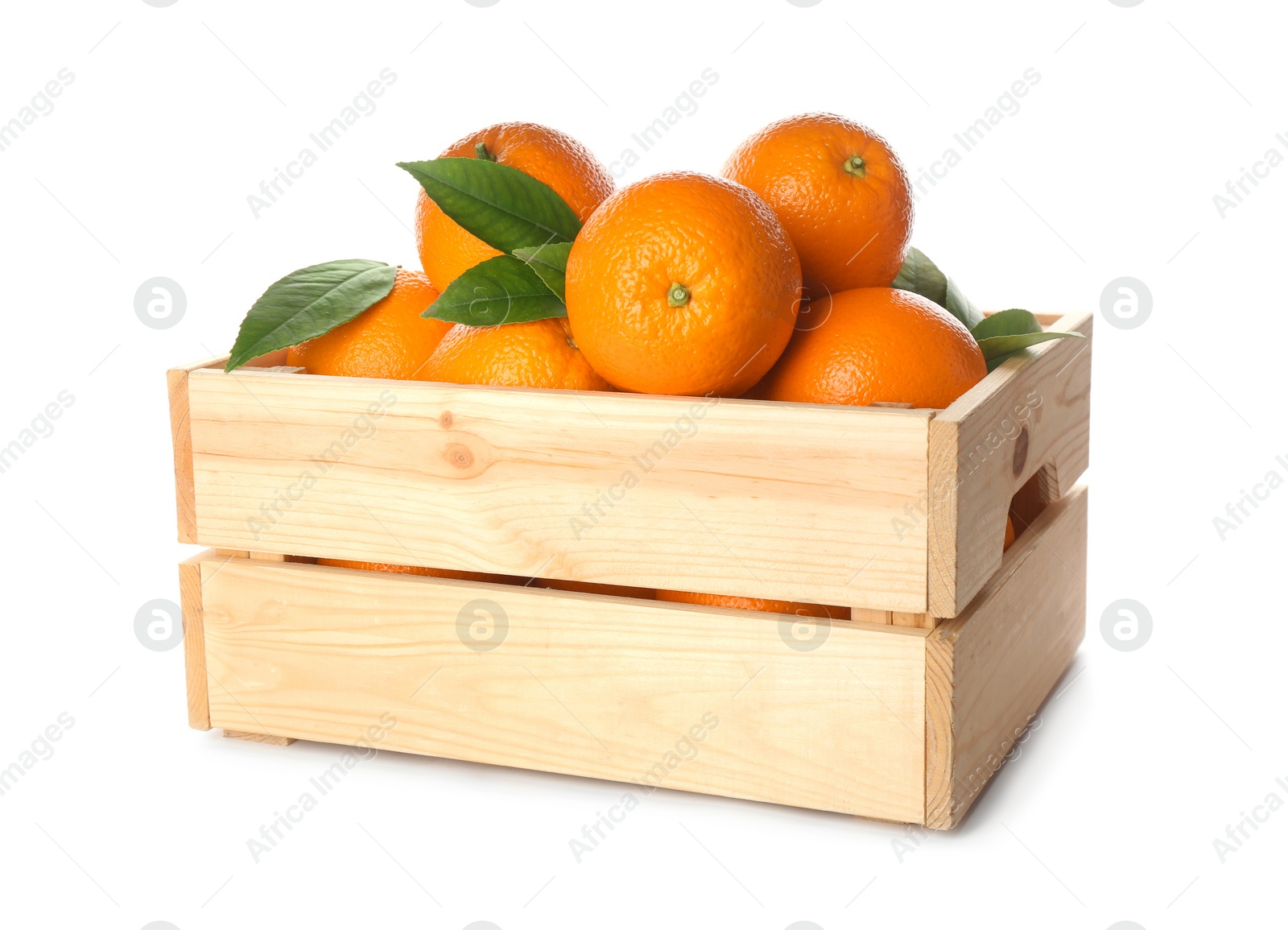 Photo of Fresh ripe oranges with green leaves in wooden crate on white background