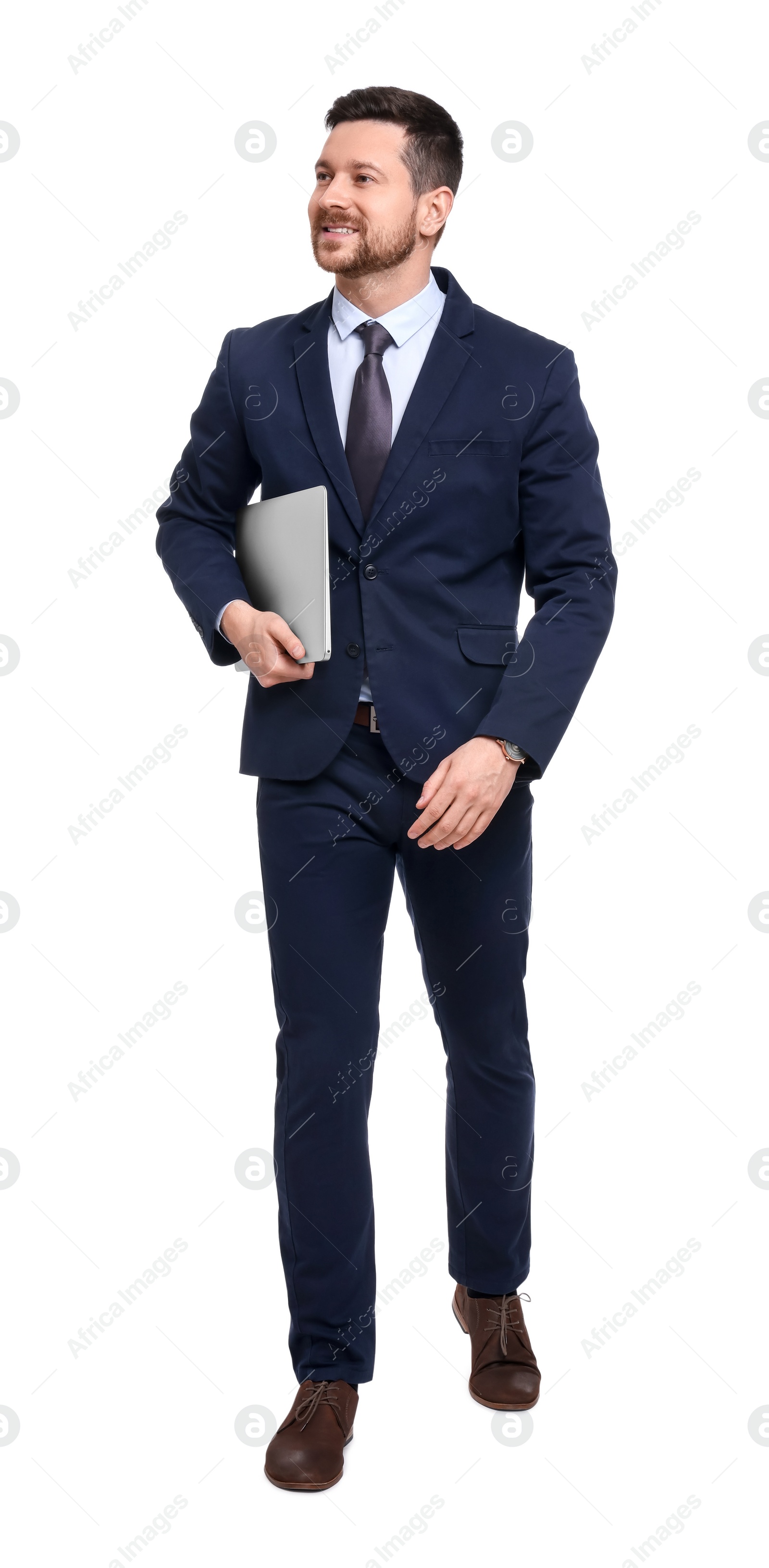 Photo of Handsome bearded businessman in suit with laptop on white background