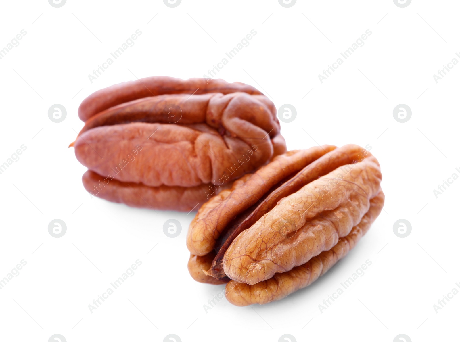 Photo of Ripe shelled pecan nuts on white background