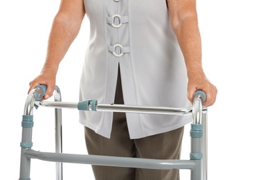 Photo of Elderly woman using walking frame isolated on white, closeup